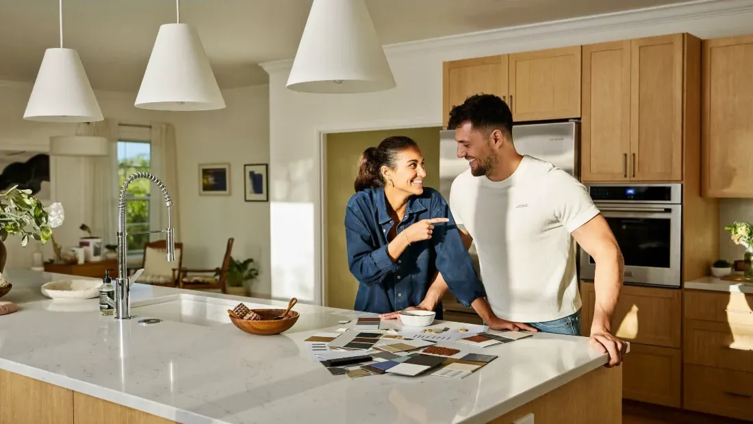 A couple choosing finishes for their kitchen remodel